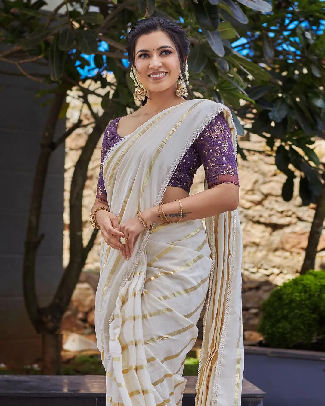 Malayalam Actress Anju Kurian Stills in White Saree Blue Blouse